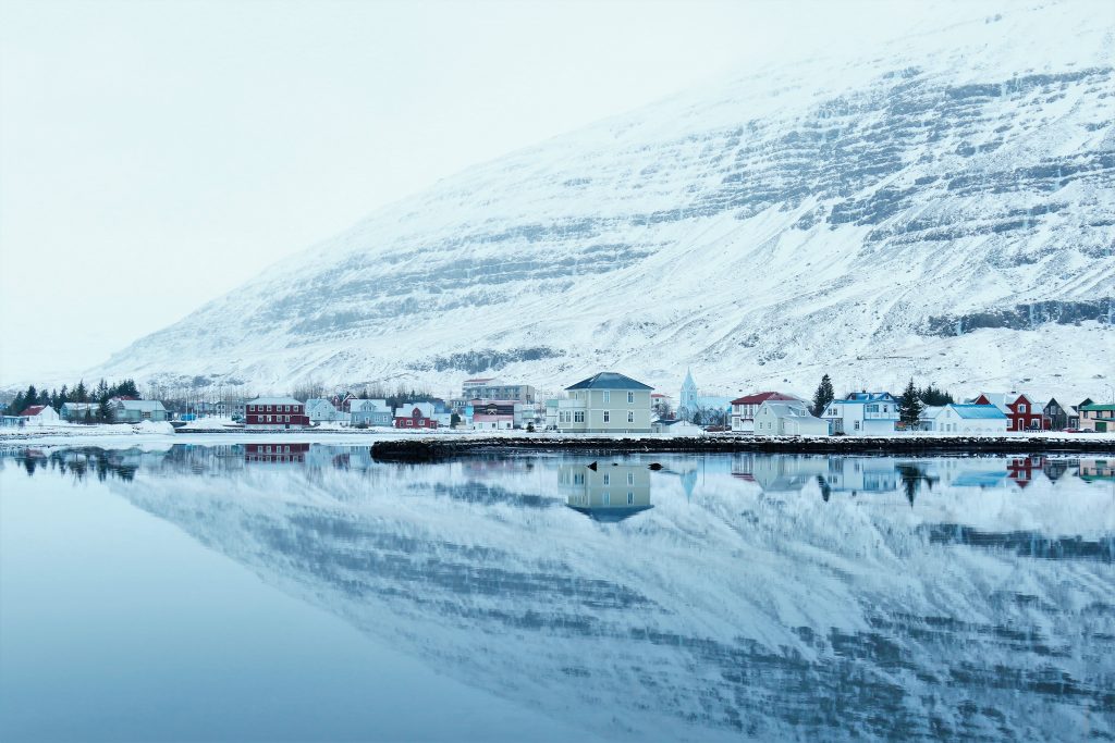 snowy village by a mountain
