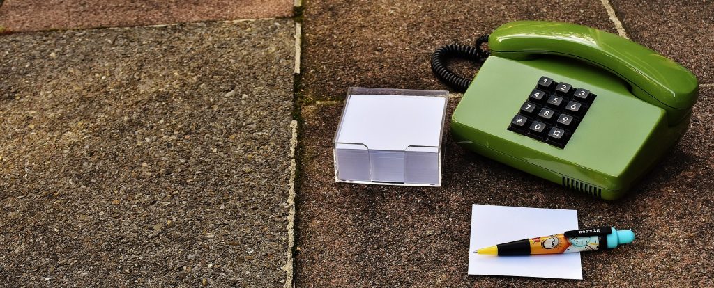 green phone and message pad