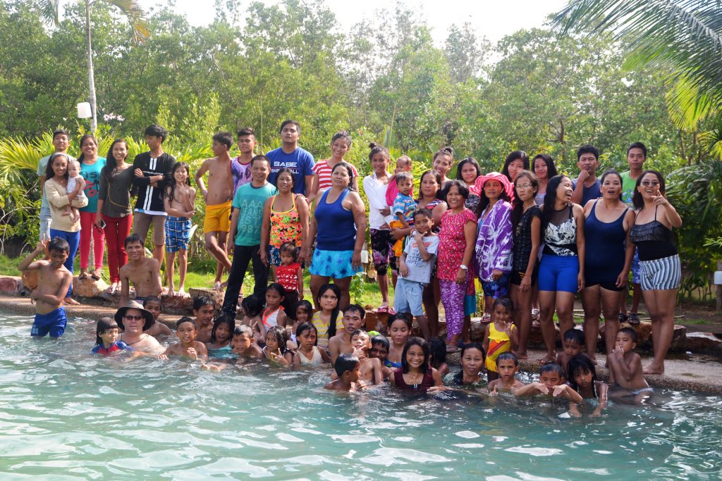 The Village of Hope college students, staff, and orphanage kids enjoy a Christmas swim outing.