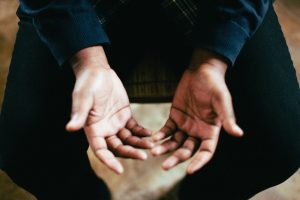 the three men held open their palms and prayed for God's comfort and peace to surround the gardener.