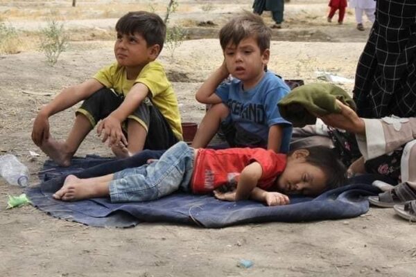 Afghan children asleep on the ground
