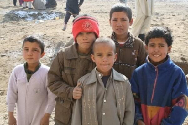 afghan boys at a camp